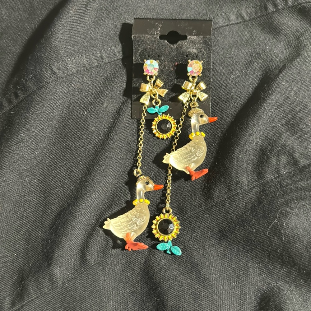 Betsey Johnson mismatch goose Farmhouse earrings.